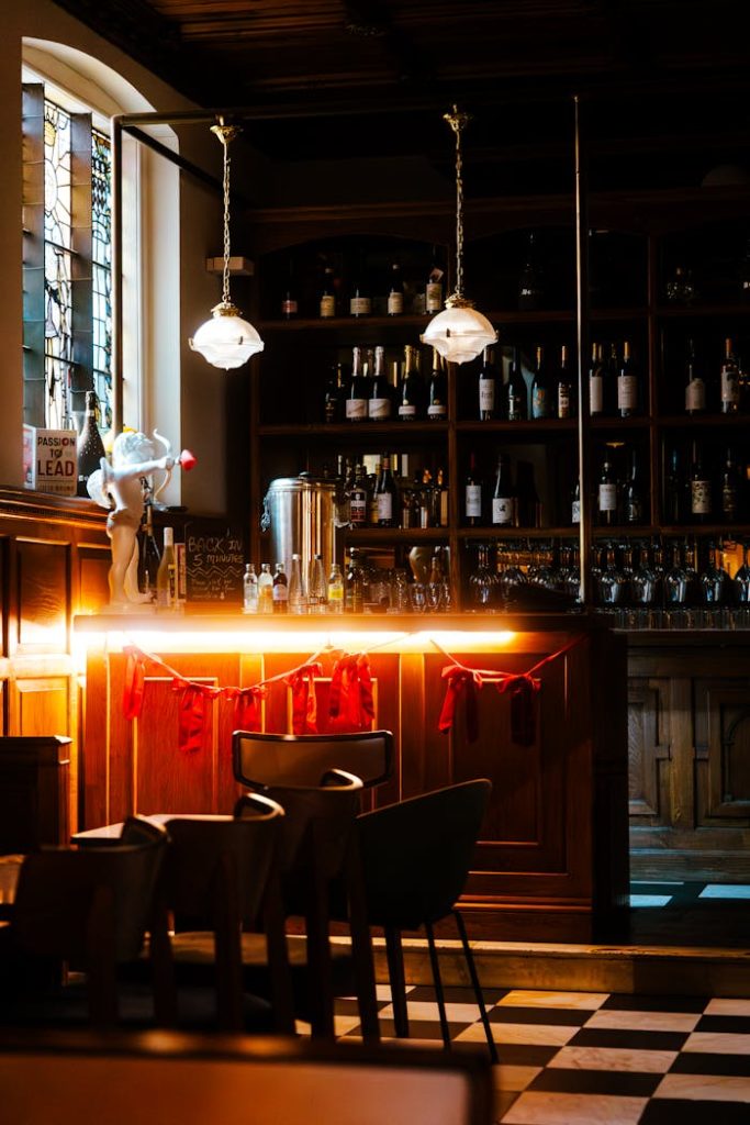 EnYe Bar Moody bar interior in London featuring warm lighting and vintage decor.