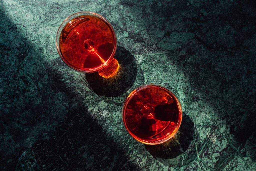 EnYe Bar two-red-cups-sitting-next-to-each-other-on-a-table-wtbrsmt9miy